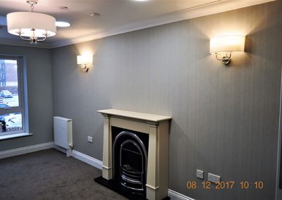 fireplace in papered wall