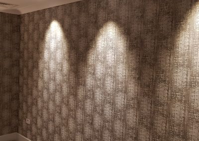 brown patterned wallpaper with spot lights