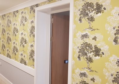 yellow tree hallway papering