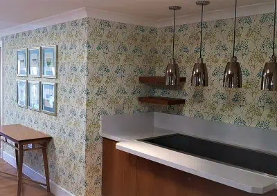 leafy wallpaper in buffet area