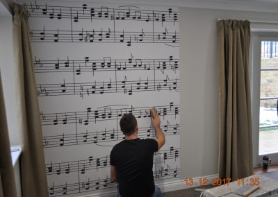 putting up musical note wallpaper
